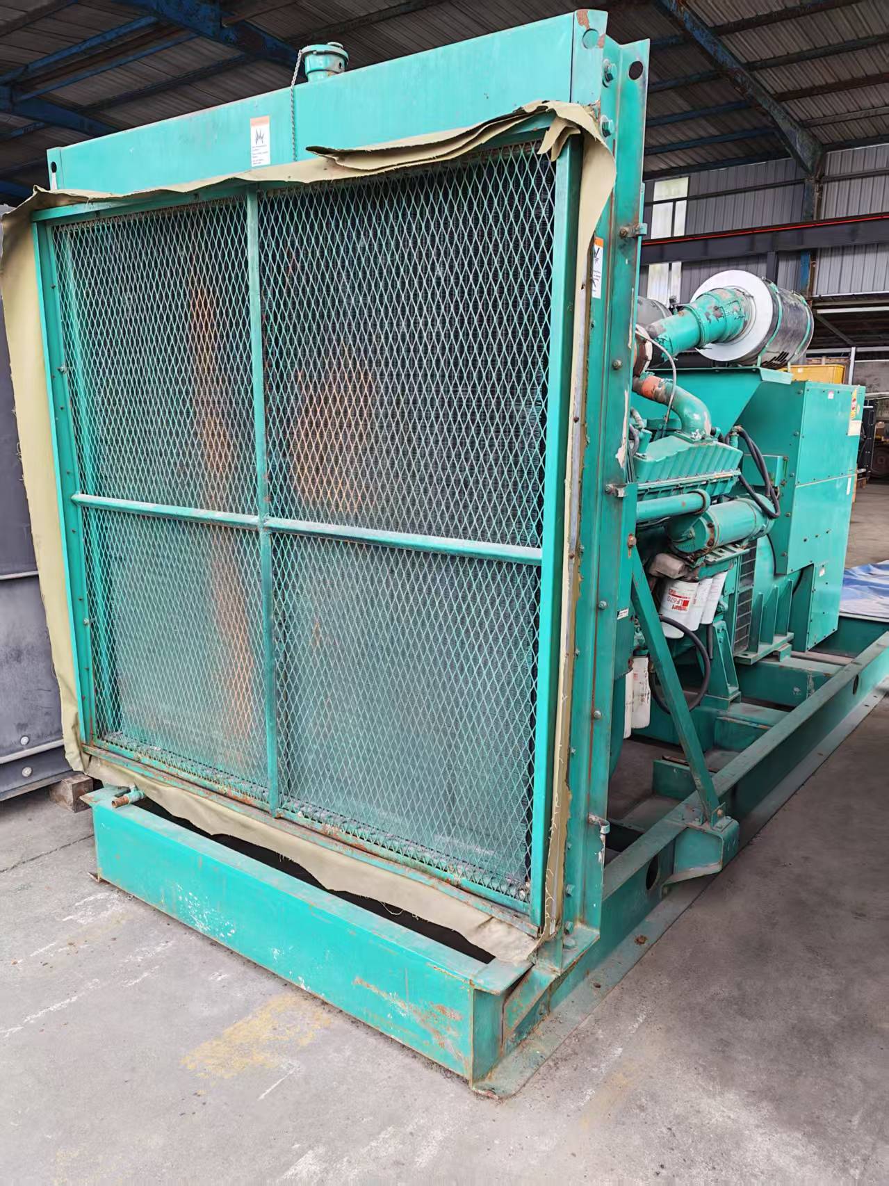 Used Cummins generator radiator and cooling package prepared for inspection
